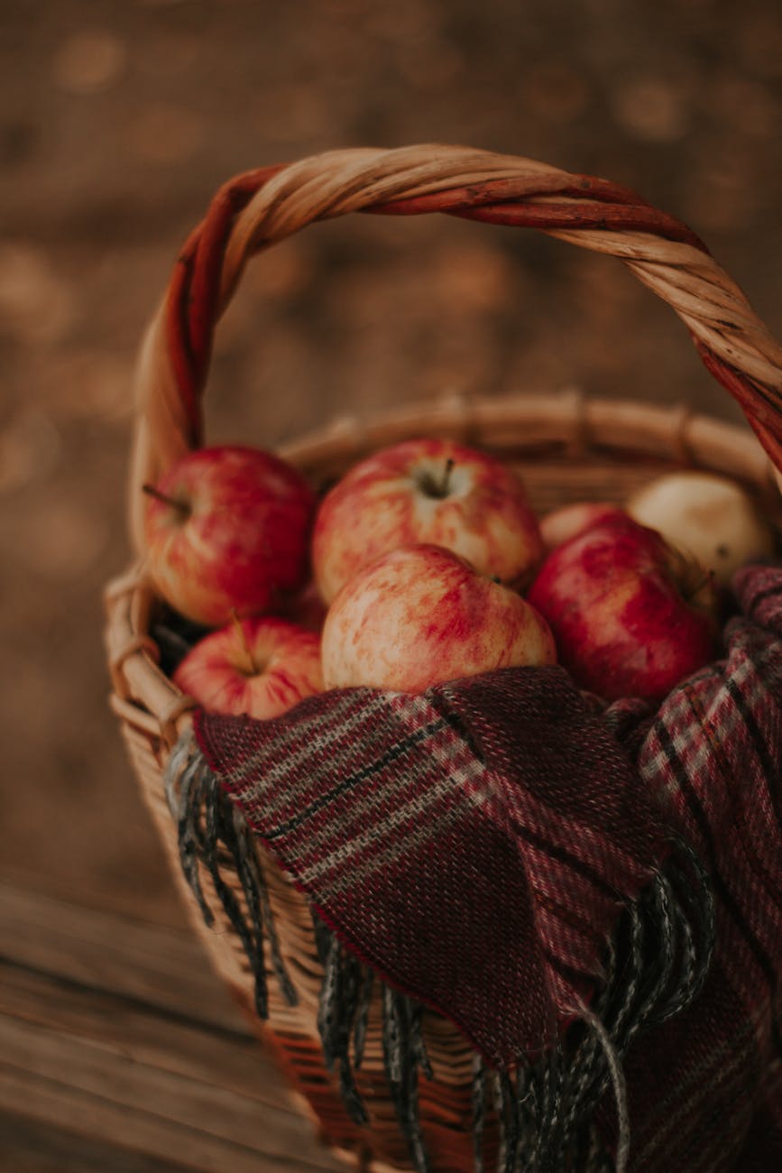 a selective focus on apples in a basket